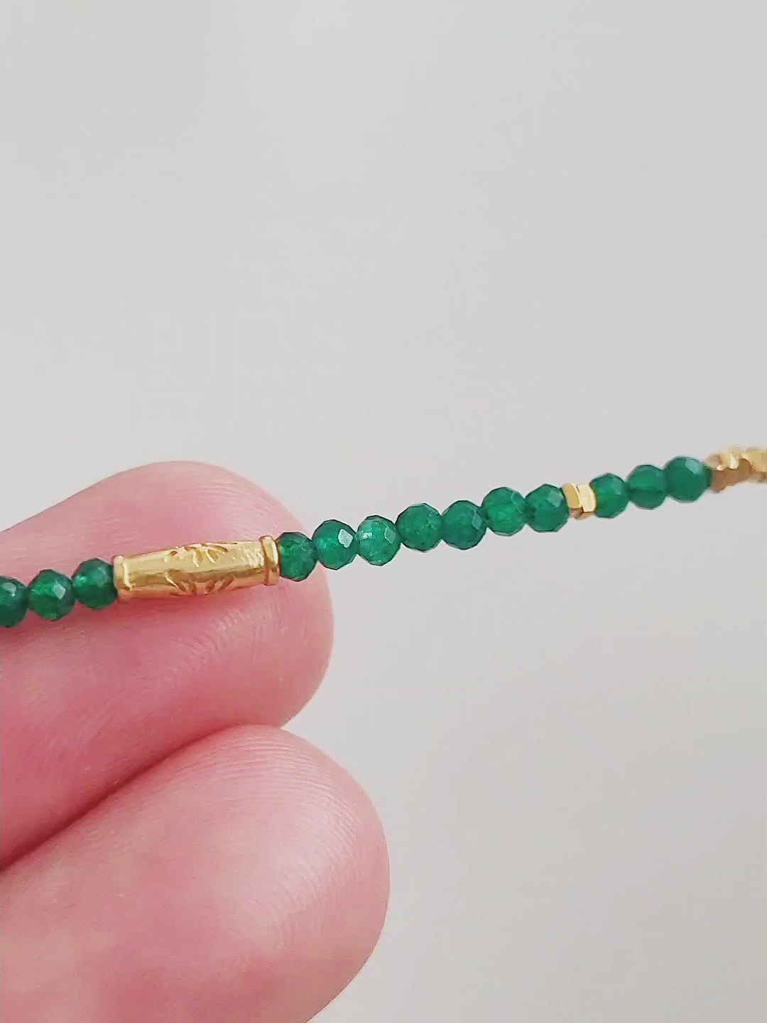 A close-up of a Green Onyx Beaded Necklace with 18k Gold Vermeil beads, showcasing an elegant minimalist design perfect for everyday wear or special occasions.