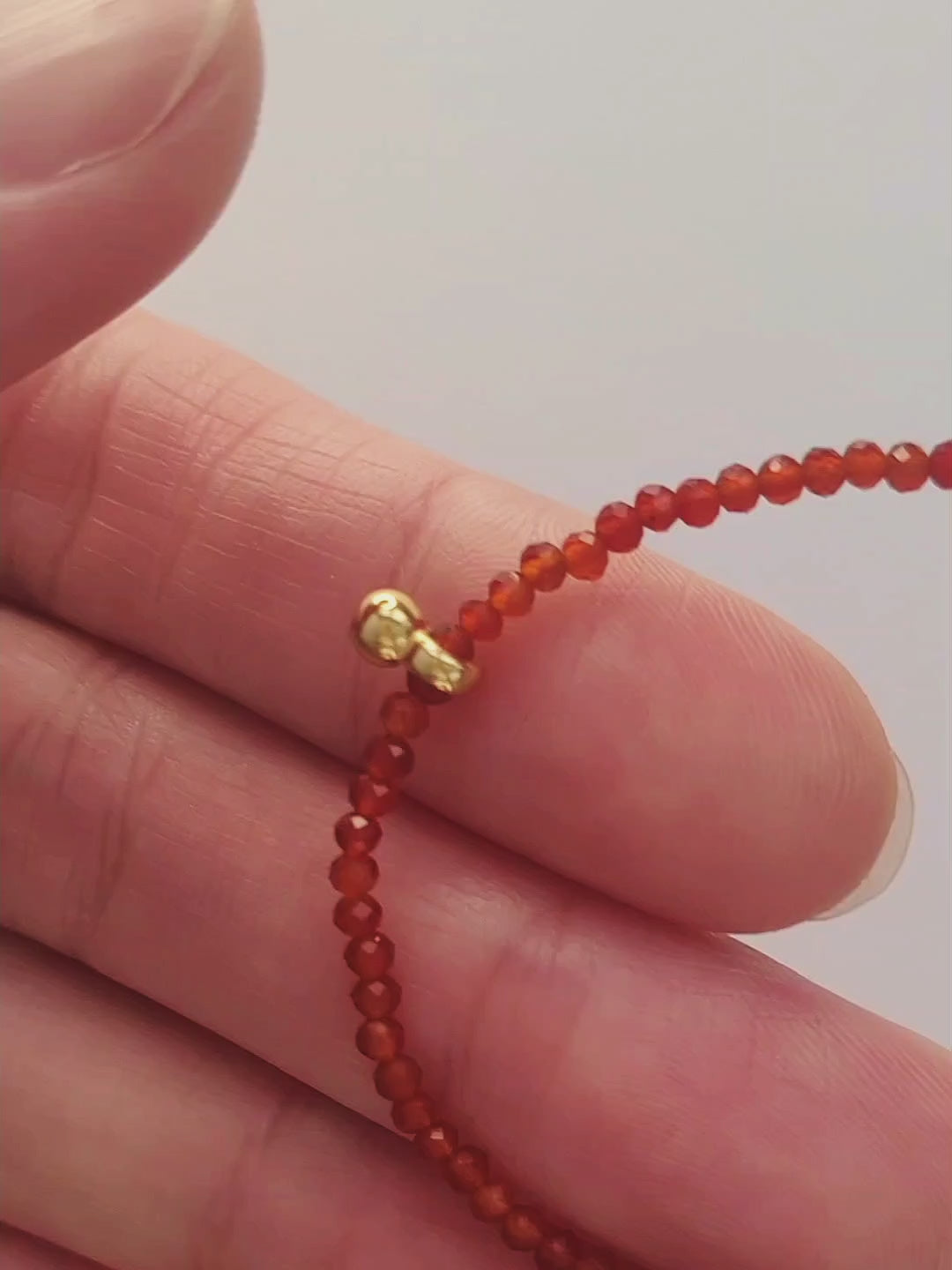 Dainty Red Agate Beaded Choker Necklace with a small gold charm, minimalist jewelry design. Valentines day gift for her.