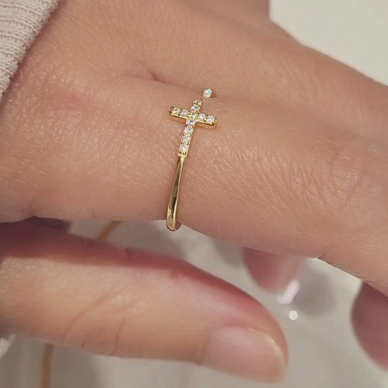 Elegant gold Cross ring adorned with brilliant zircons, showcasing timeless beauty and sophistication.