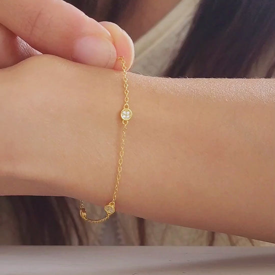 A stylish gold circle bracelet on a wrist, showcasing a minimalist design ideal for layering with other jewellery