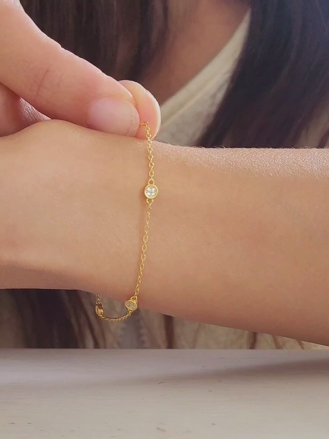 A stylish gold circle bracelet on a wrist, showcasing a minimalist design ideal for layering with other jewellery