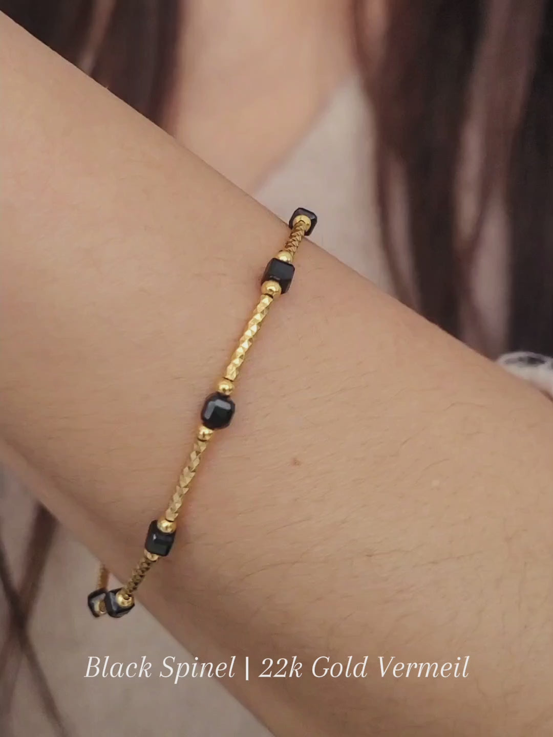 Close-up of a vintage-inspired Black tourmaline Bracelet featuring faceted black beads and textured gold vermeil bars on a wrist. Delicate and dainty bracelet gift for her.