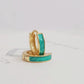 Elegant gold and turquoise green enamel huggie hoop earrings, featuring a chic design that adds flair to your everyday style.