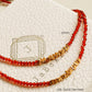 Two beaded necklaces featuring red onyx gemstone and 22k gold vermeil nuggets displayed on a textured white surface.