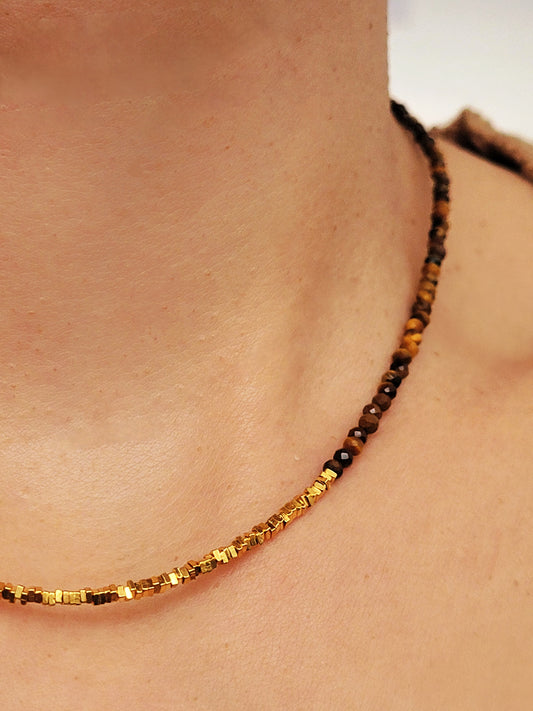 Close-up of woman wearing Tiger’s Eye gemstone choker necklace with 22K gold vermeil nugget beads 