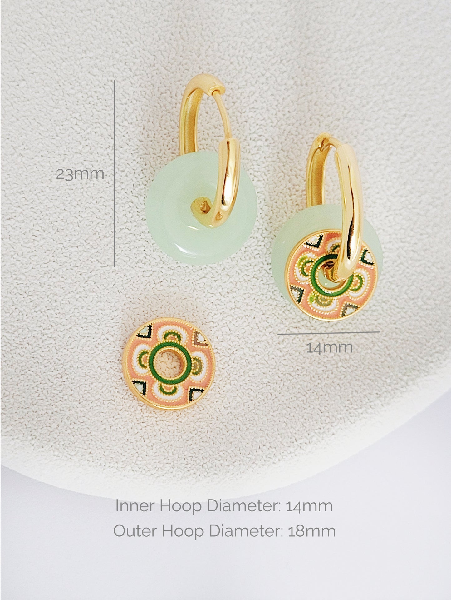 Exquisite gold hoop earrings adorned with a tile pattern disc and jade donut ring, a sophisticated accessory for the discerning wearer.