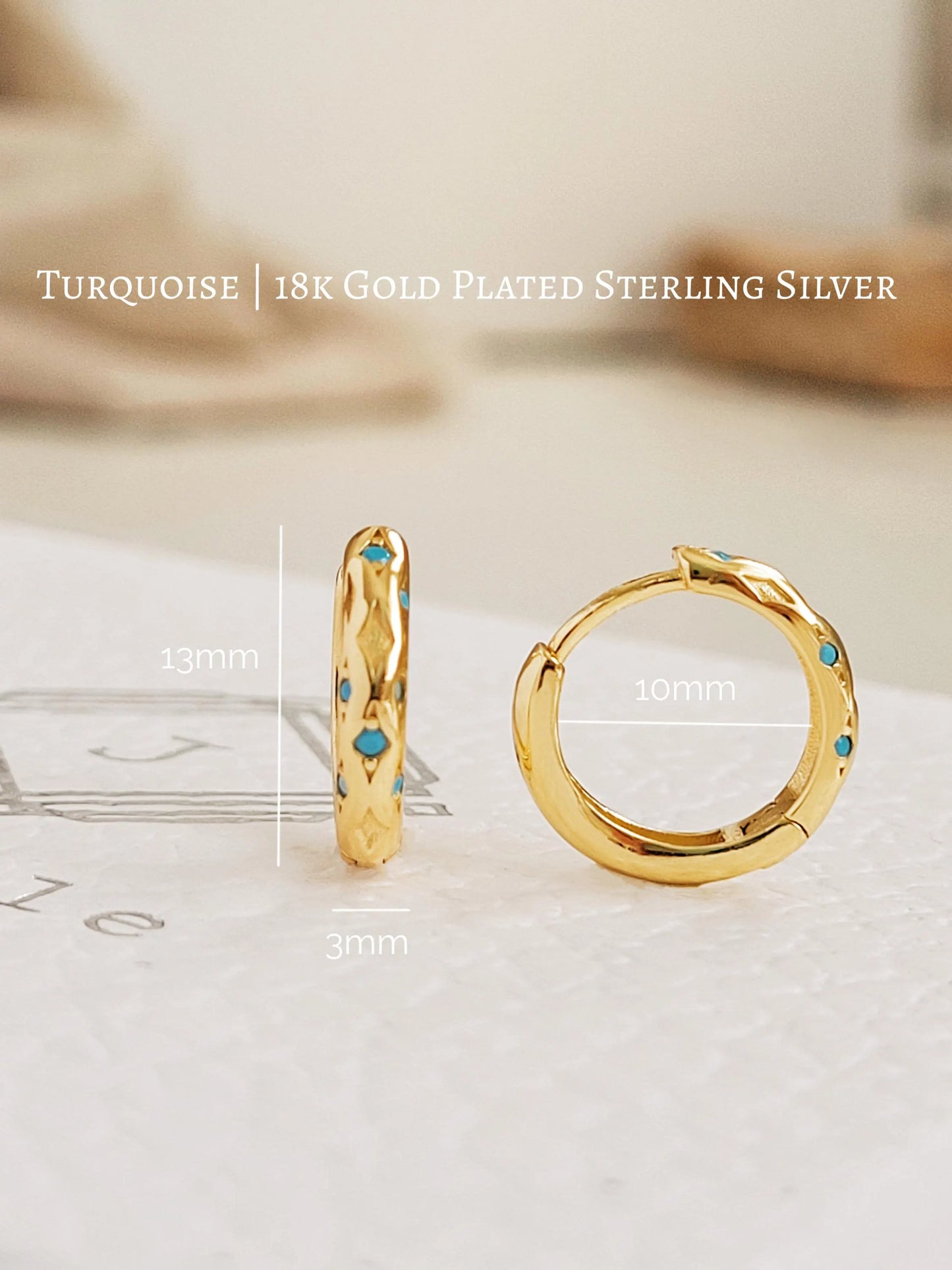 Close up of Turquoise star huggie hoop earring crafted in gold plated sterling silver, featuring a cosmic star inspired design. Minimalist earring design, perfect birthday gift for her.