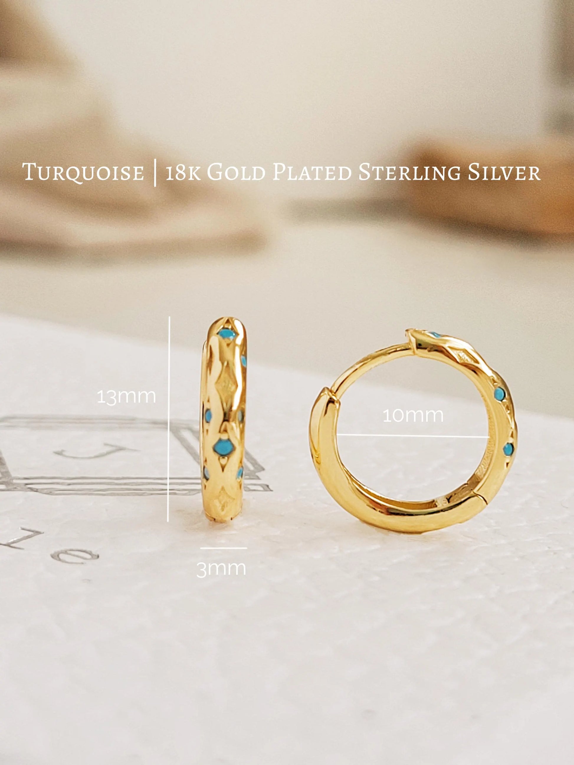Close up of Turquoise star huggie hoop earring crafted in gold plated sterling silver, featuring a cosmic star inspired design. Minimalist earring design, perfect birthday gift for her.