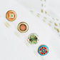 Stunning gold earrings adorned with hand painted enamel to highlight the beauty of vintage tile pattern adding a touch of elegance.