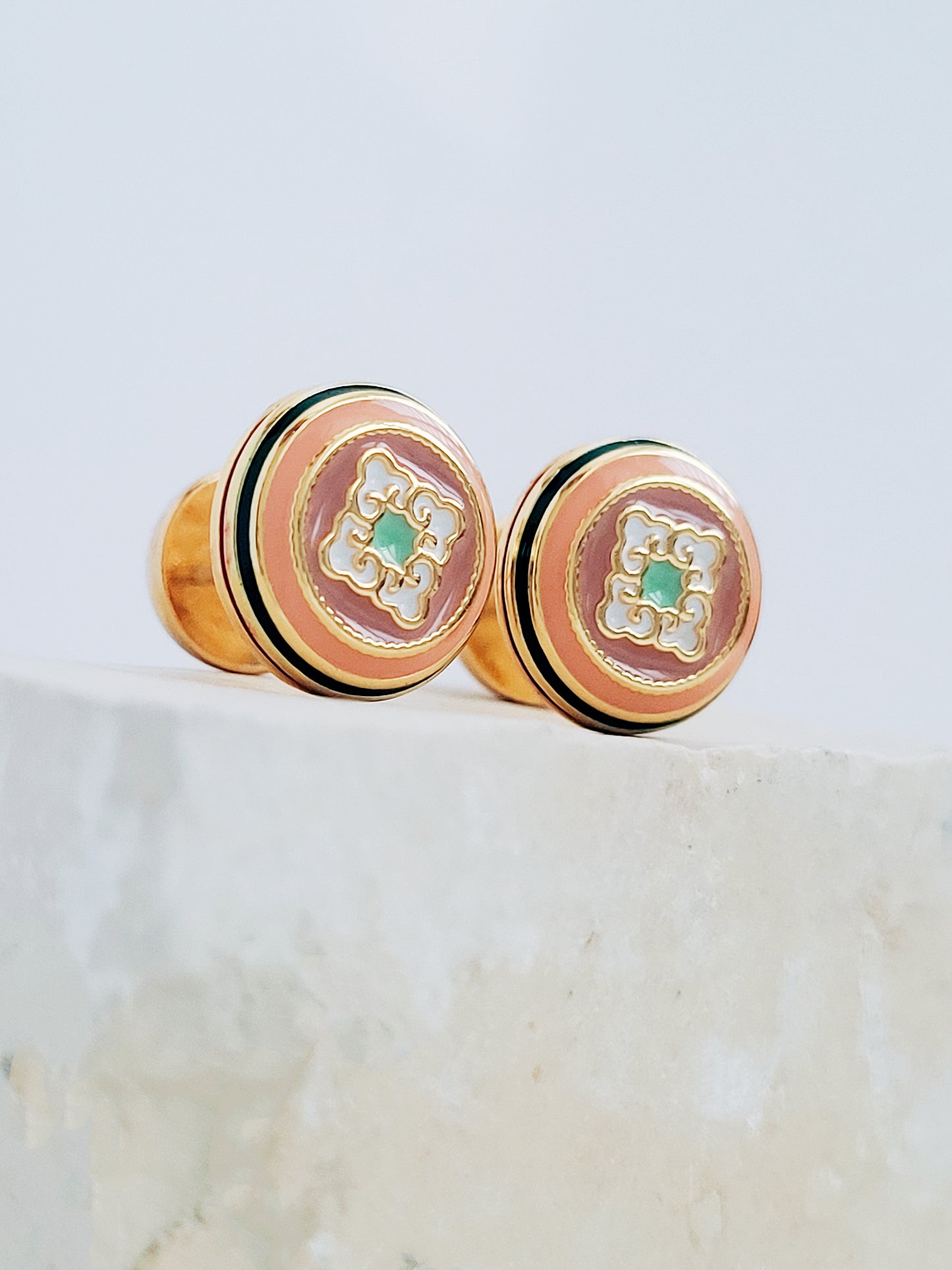 Stunning gold earrings adorned with hand painted enamel to highlight the beauty of vintage tile pattern adding a touch of elegance.