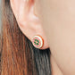 Close-up of a woman’s ear wearing a pair of Retro Gothic tile pattern enamel stud earrings in pink, dark green, and gold. The intricate design features a vintage-style pattern with a bold color combination, creating a striking and elegant look.