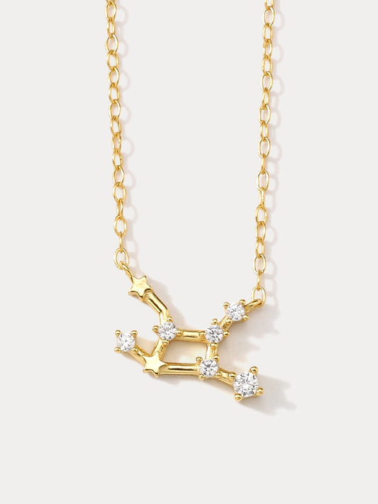 A dainty gold necklace with a pendant featuring a stylized Virgo zodiac constellation sign with sparkling zircons. Perfect jewellery gift for birthday.