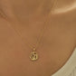 CLose up of a woman wearing paris necklace