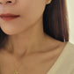 woman wearing paris necklace